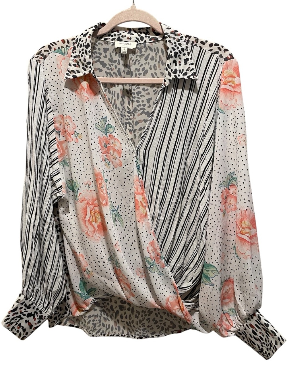 Umgee blouse in a mixed print of florals, stripes, and leopard spots. Size S